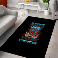 Black area rug with multicolor tiki skull graphic and blue slogan text