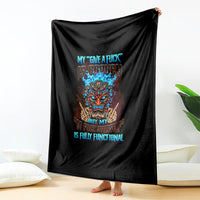 Black skull blanket with colorful tiki skull design and blue text, hanging upright