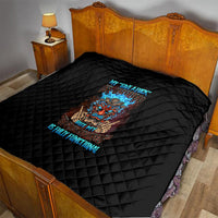 Black quilt on bed with diamond quilting and colorful tiki skull graphic centerpiece