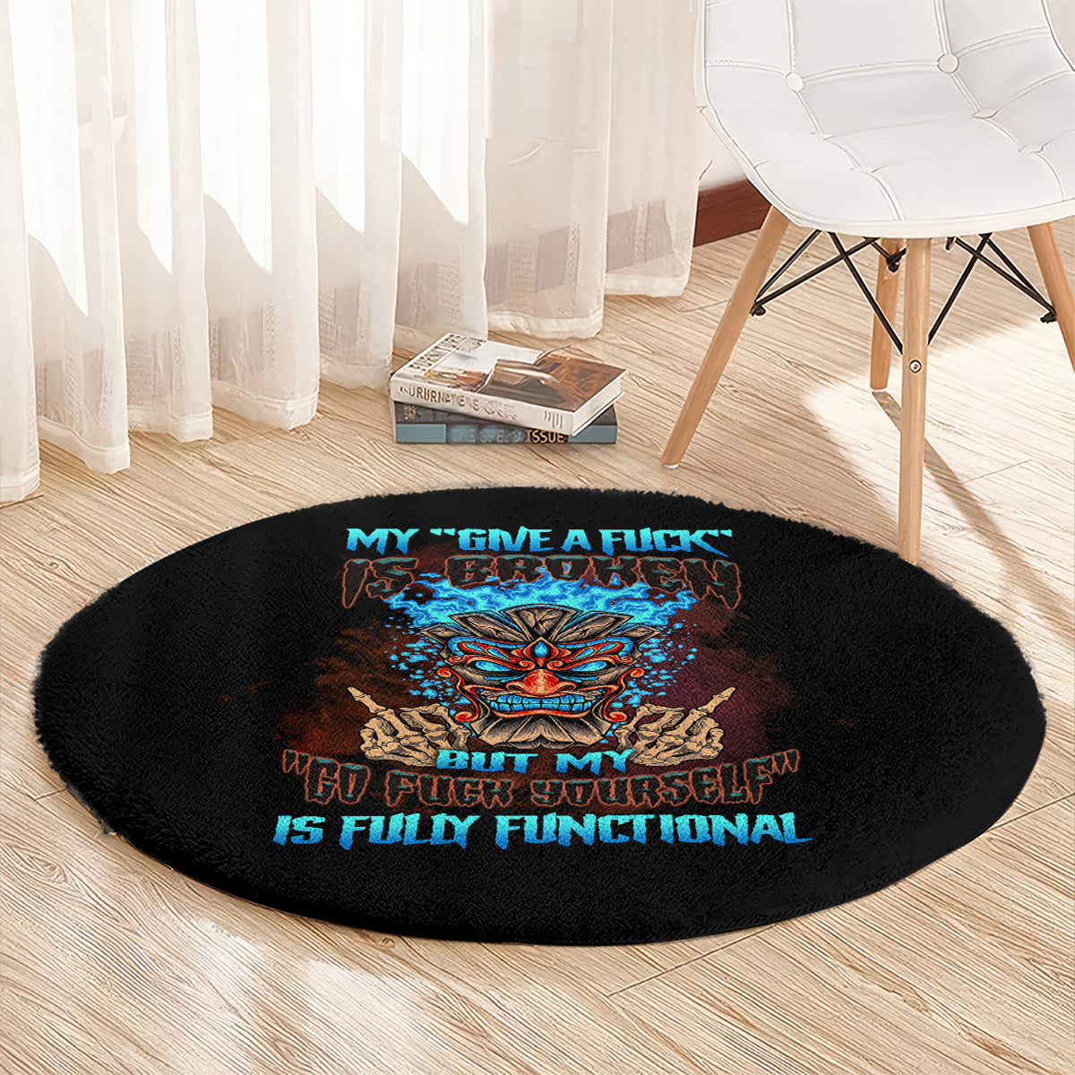 Black round carpet with centered colorful tiki skull and slogan lettering