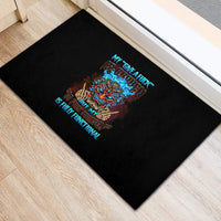 Black rubber doormat with colorful tiki skull graphic and blue text design