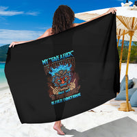 Black tiki skull sarong with multicolor skull print and text on back, wide drape