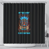 Black shower curtain with colorful tiki skull graphic and blue text on center