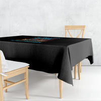 Black tablecloth with colorful skull Tiki graphic across the center