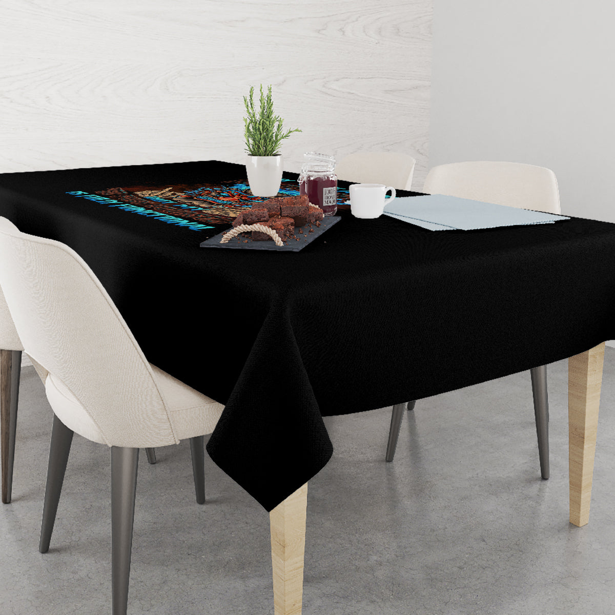 Black tablecloth with colorful skull Tiki design on a dining table