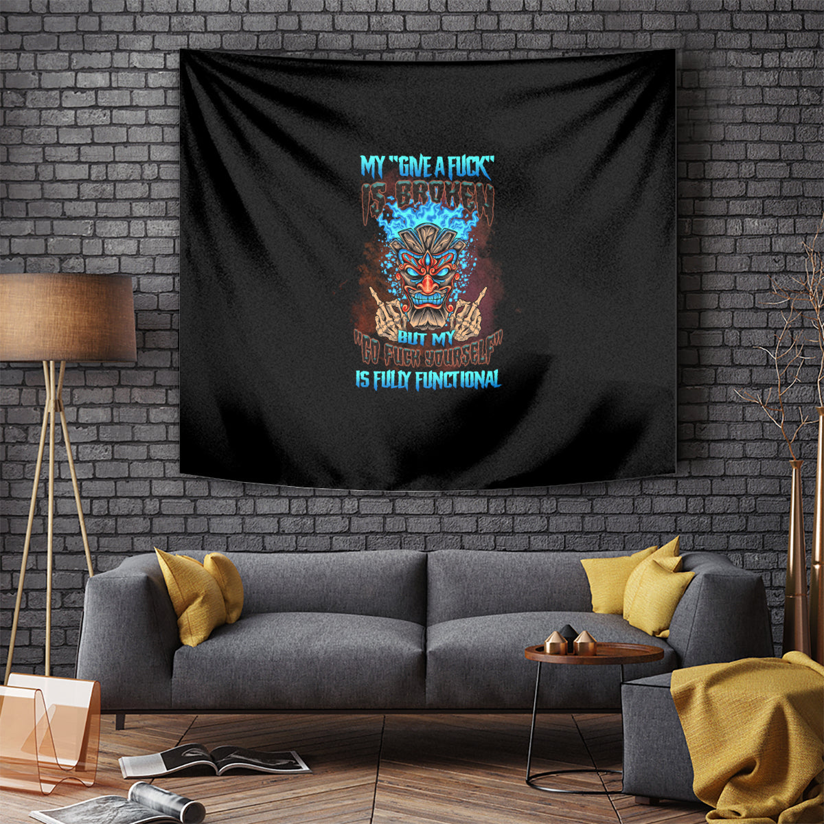 Black tiki skull tapestry with colorful central face graphic and stylized lettering