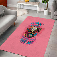 Pink area rug with colorful skull-and-flowers graphic and devotional text