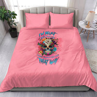 Pink duvet cover bedding set with two matching pillows and colorful skull flower graphic