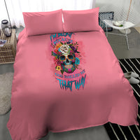 Pink bedding set with duvet and two pillows, centered floral skull design in bright colors