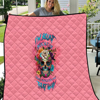 Pink quilt with black trim edge and centered colorful skull floral artwork