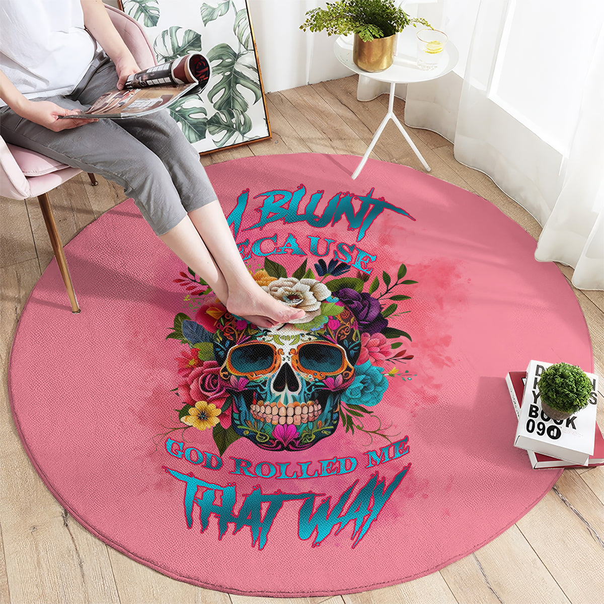Pink round carpet with colorful skull graphic and stylized lettering, decorative rug