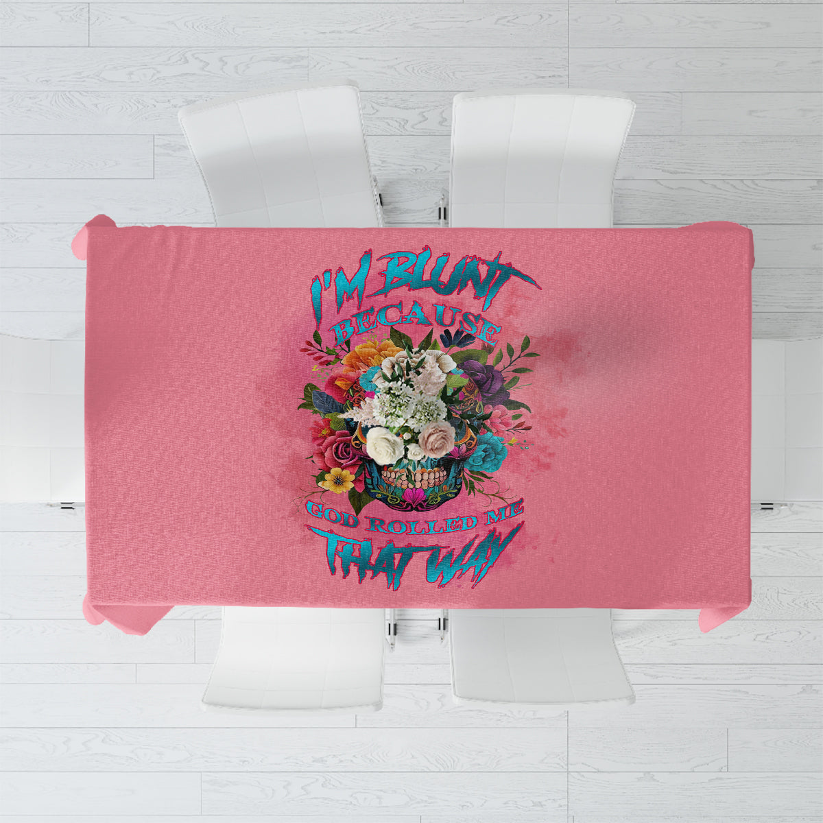 Pink rectangular tablecloth featuring a central multicolor floral quote design.