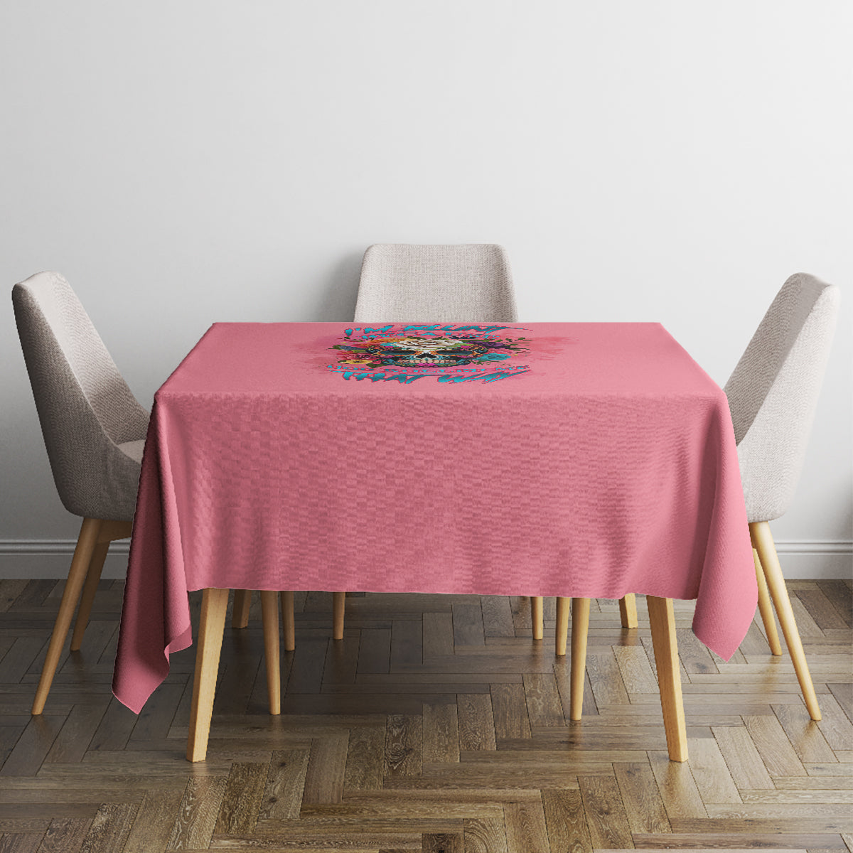 Pink tablecloth with multicolor floral quote print on a square dining table.