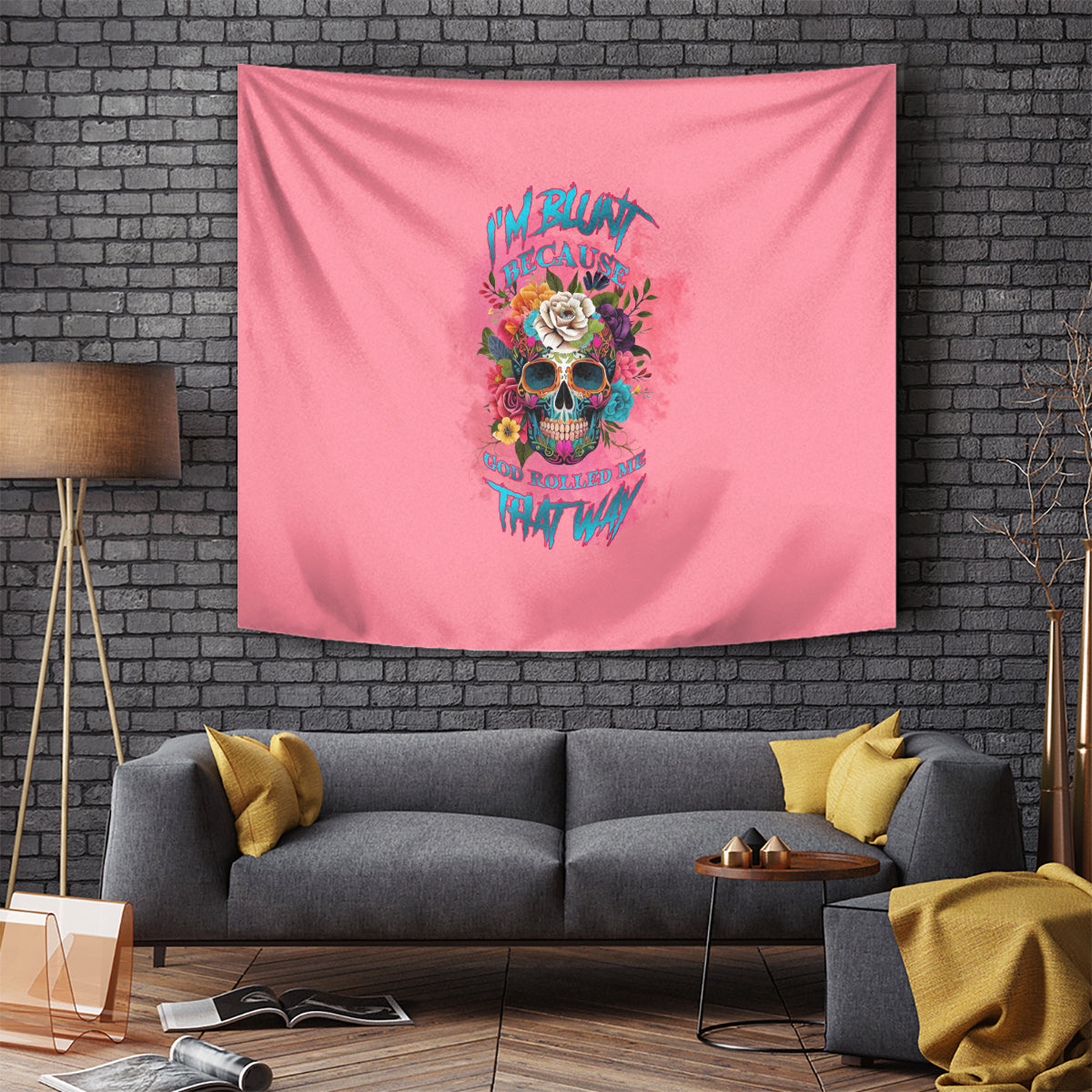 Pink wall tapestry featuring a skull with floral crown and vivid text