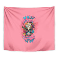 Pink tapestry featuring a centered skull with rose wreath and vibrant text