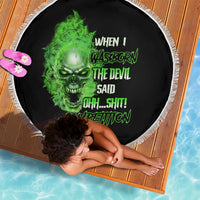 Round beach blanket with black base, neon-green skull graphic, and white fringe border