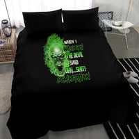 Black bedding set with green skull artwork and slogan centered on duvet, two pillowcases