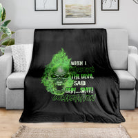 Black throw blanket with green skull graphic and distressed text