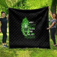 Black quilt blanket with green skull graphic and bold text, diamond-stitched edge-to-edge