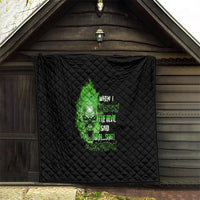 Black quilt blanket featuring green skull graphic with stacked text, quilted diamond texture