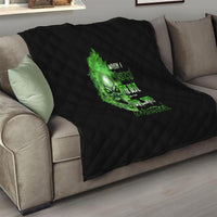 Black diamond-quilt blanket with centered green skull graphic and neon text accents