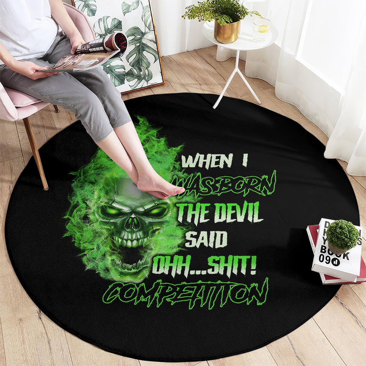 Black round carpet with green skull and rocker-style text graphic