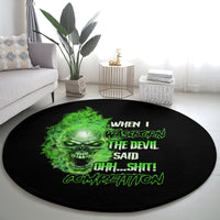 Black round carpet with green skull graphic and stacked text, centered