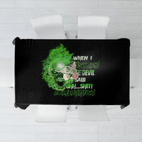 Black tablecloth, folded view, neon green skull centerpiece with message text