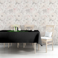 Black tablecloth with neon green skull graphic on table with chairs