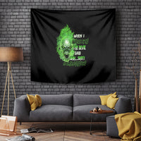 Black wall tapestry with neon green skull face and quote text, rectangular fabric