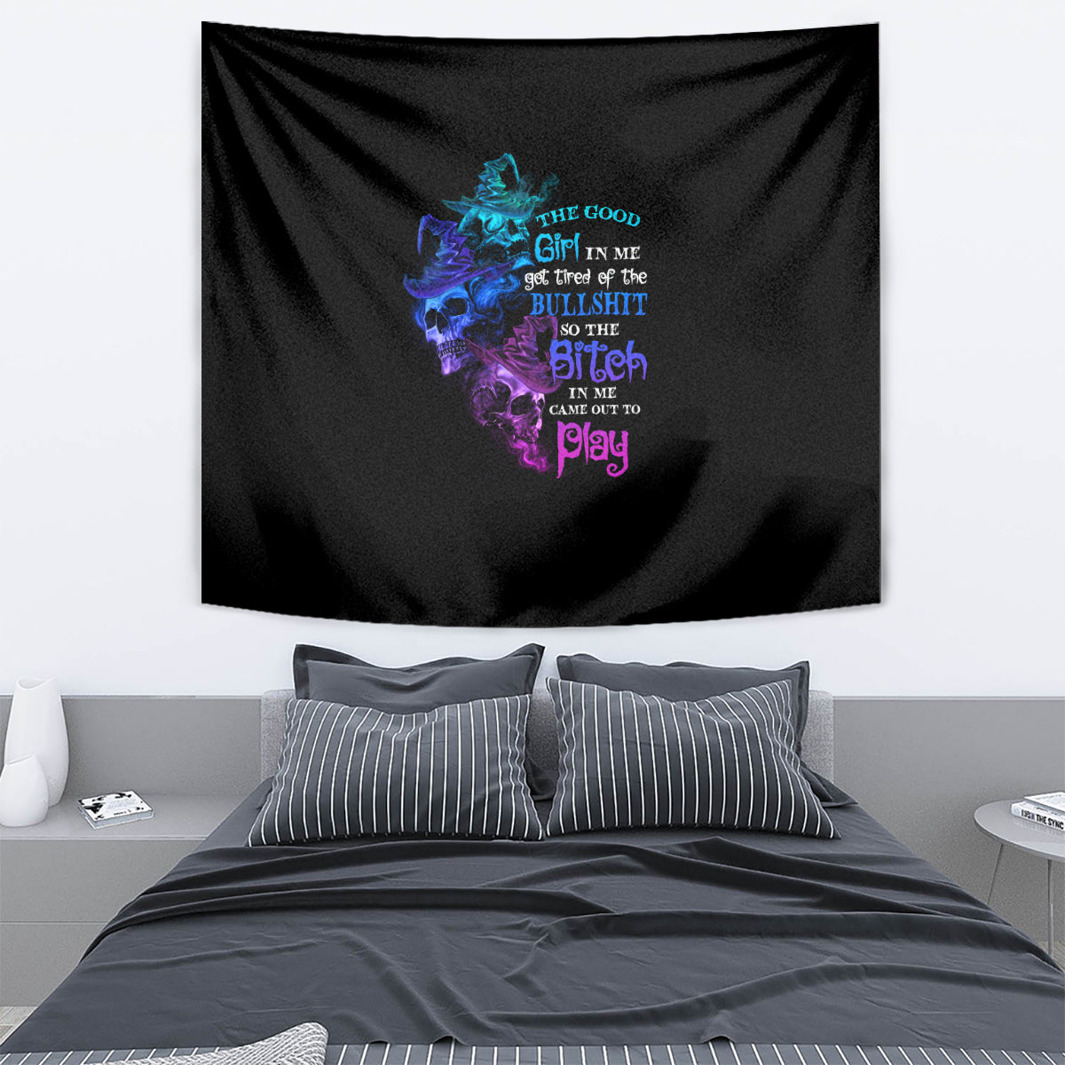 Black Halloween tapestry with multicolor skull witch graphic, hanging on wall