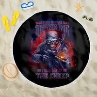 Round beach blanket, black with centered skull-gun graphic and white fringe