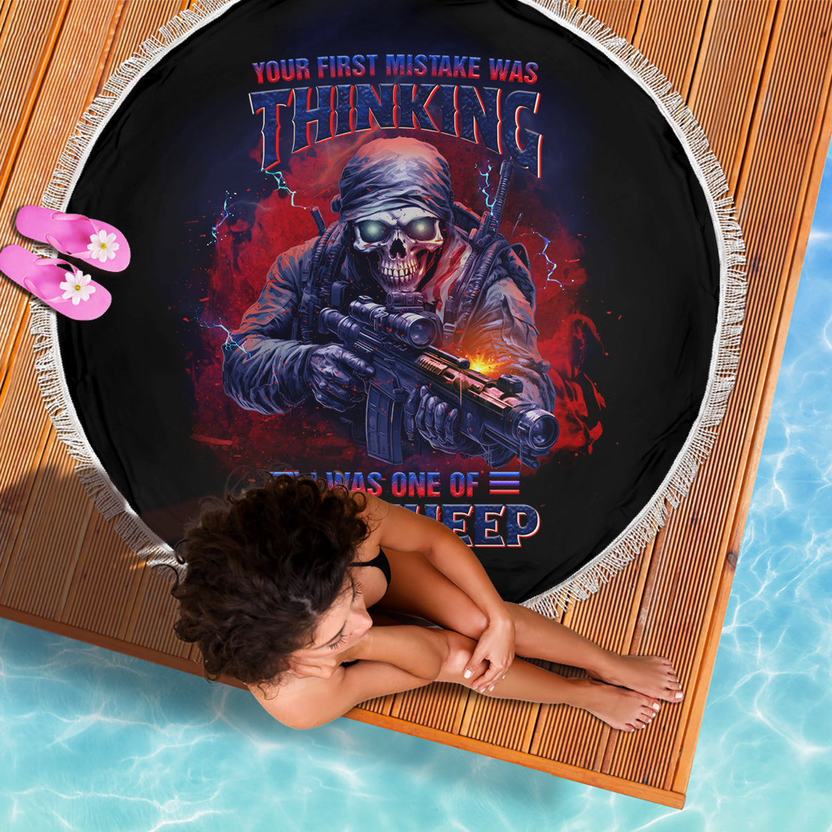 Round beach blanket, black with sci-fi skull gun graphic and fringed edge