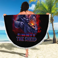 Round beach blanket, black with skull-gun graphic and tassel fringe border