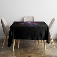 Black tablecloth with colorful rectangular graphic on top of dining table
