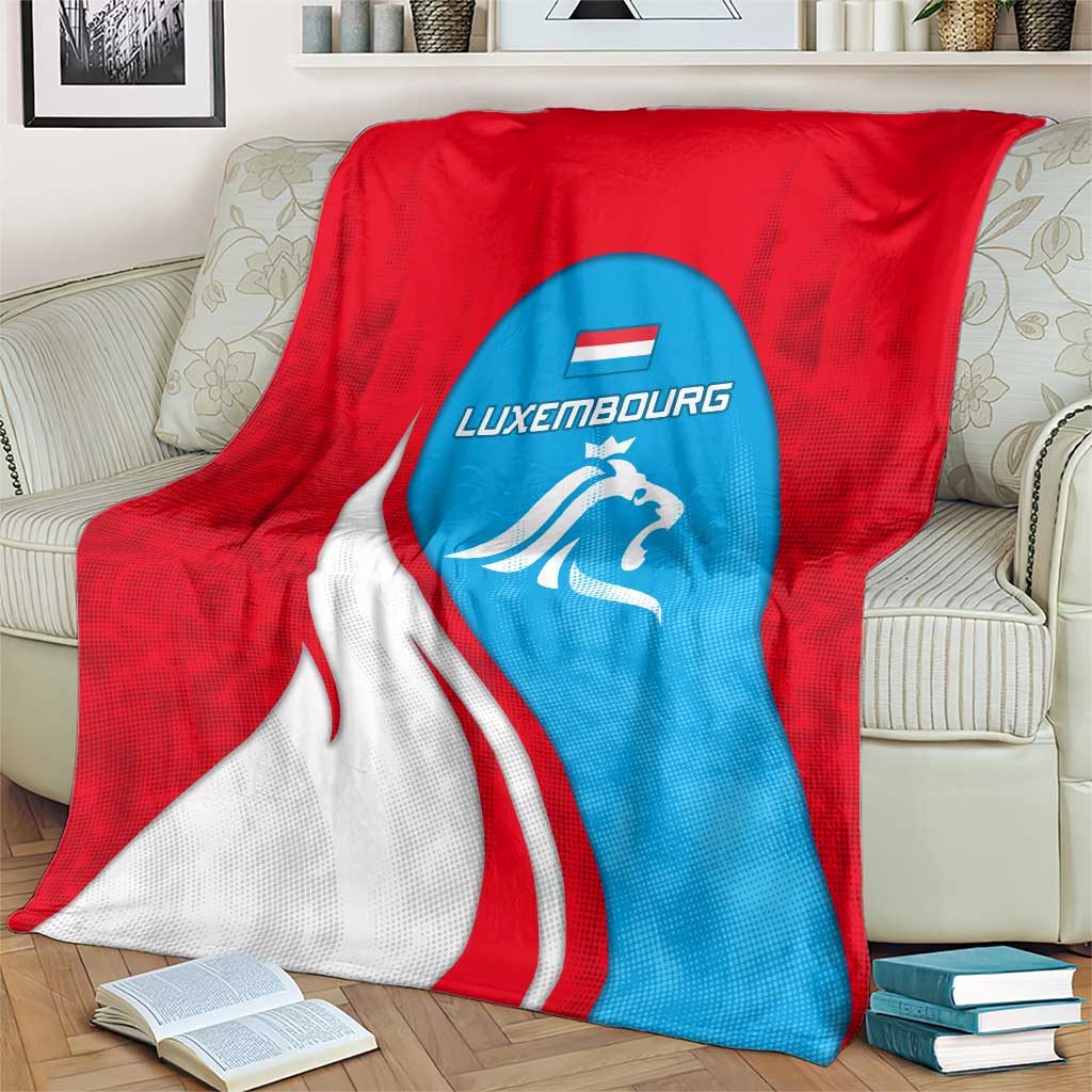 Red and blue Luxembourg blanket with white lion crest and Luxembourg text