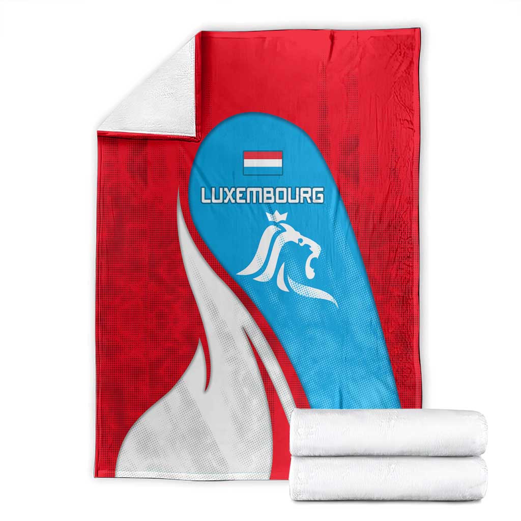 Folded Luxembourg flag blanket with lion crest, red white and blue design