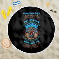Round black beach blanket with white fringe and blue-orange skull tiki design
