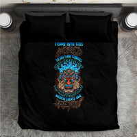 Black bedding set comforter with colorful skull tiki center graphic, viewed from top
