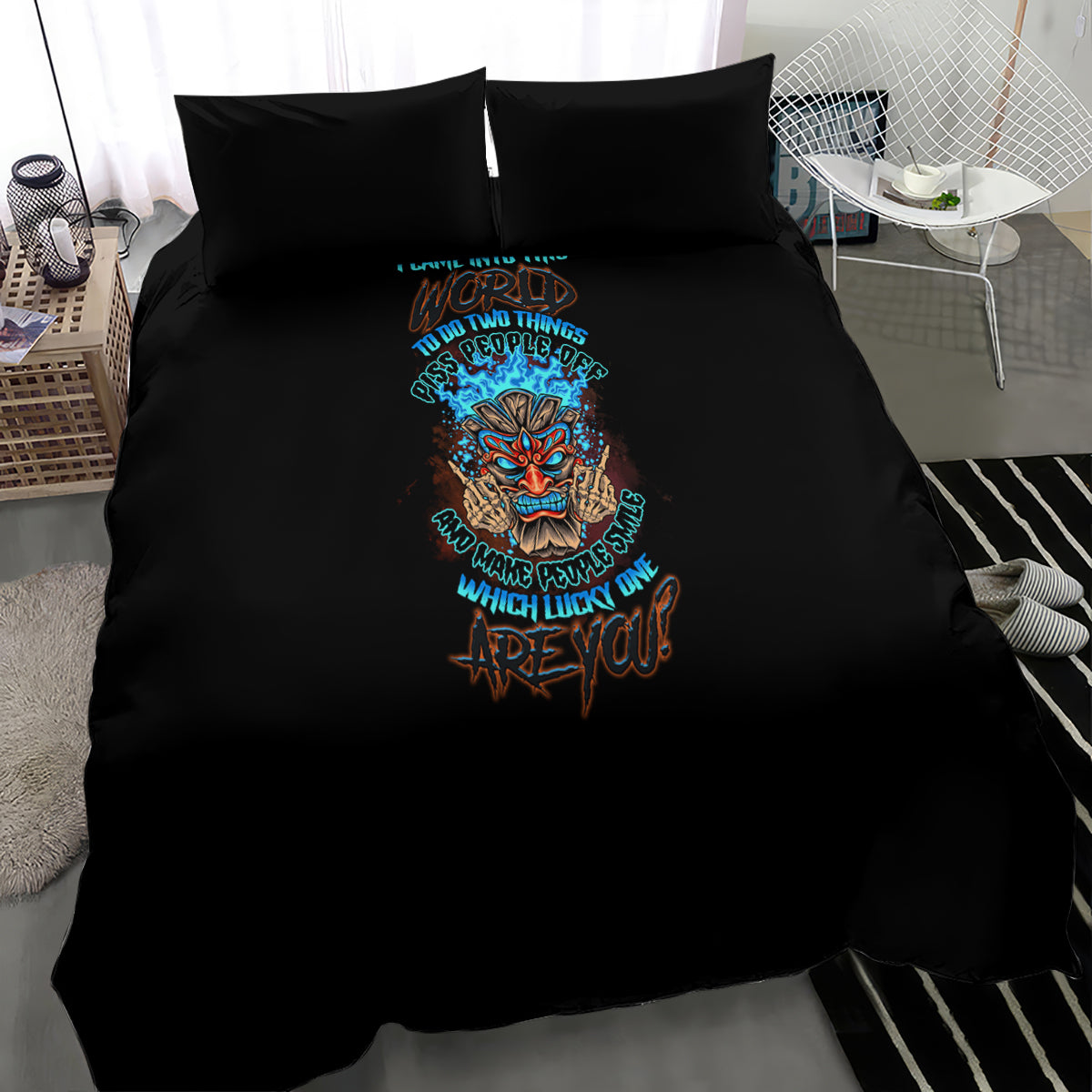 Black bedding set comforter with colorful skull tiki artwork and teal text, corner view