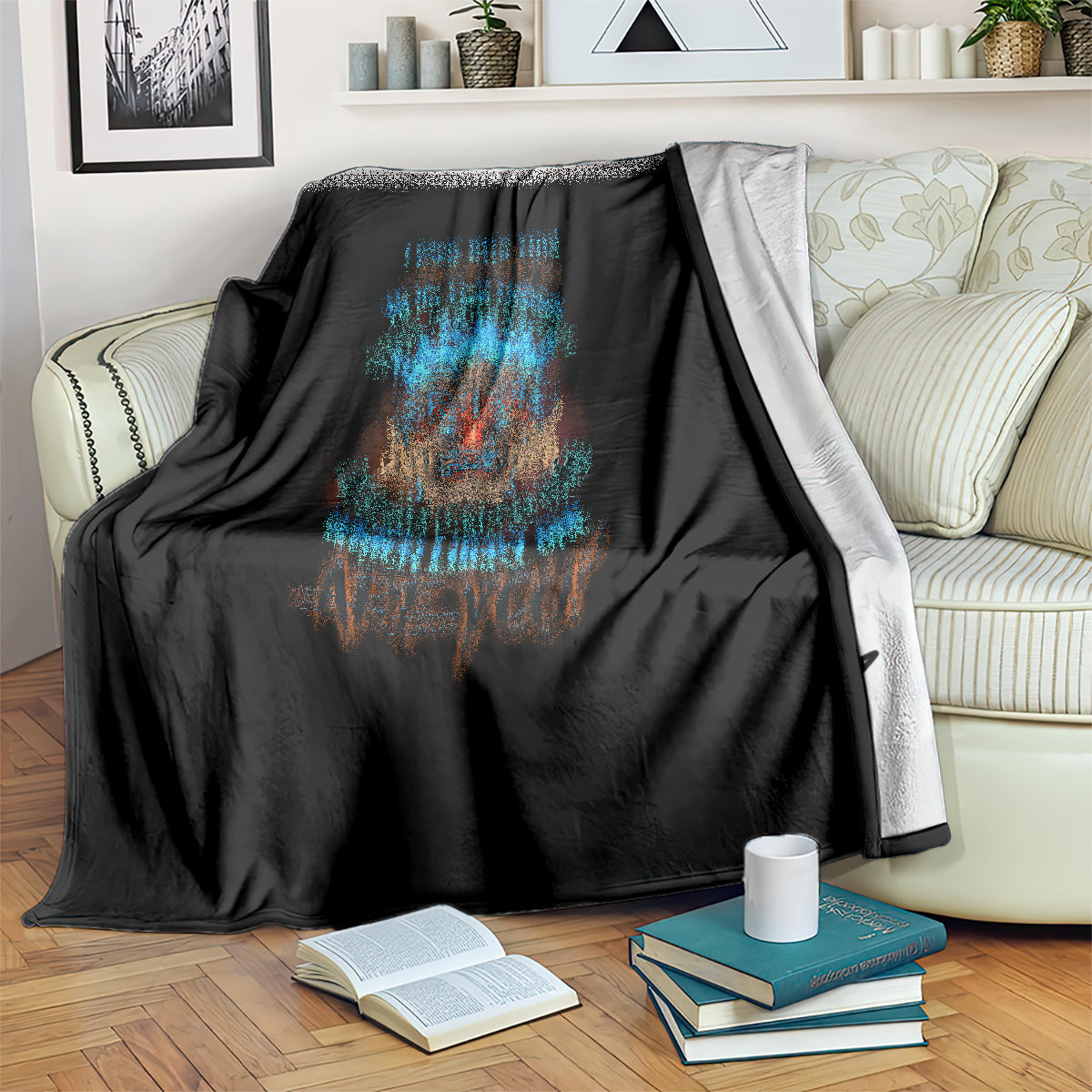 Black blanket with colorful skull tiki emblem and text, draped over sofa back