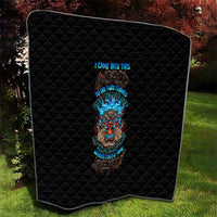 Black quilt with diamond stitching and bright tiki skull design on front