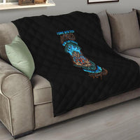 Black diamond-quilted couch throw featuring colorful tiki skull graphic in center