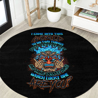 Round black rug featuring a colorful tiki skull emblem and slogan lettering