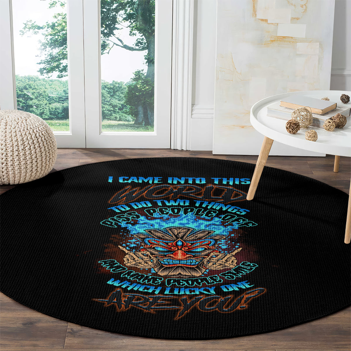 Round black rug with colorful tiki skull print and stacked slogan lines