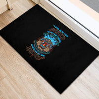 Black rubber doormat with colorful skull tiki graphic and message typography