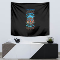 Black skull tiki tapestry with multicolor text graphic, centered on white wall