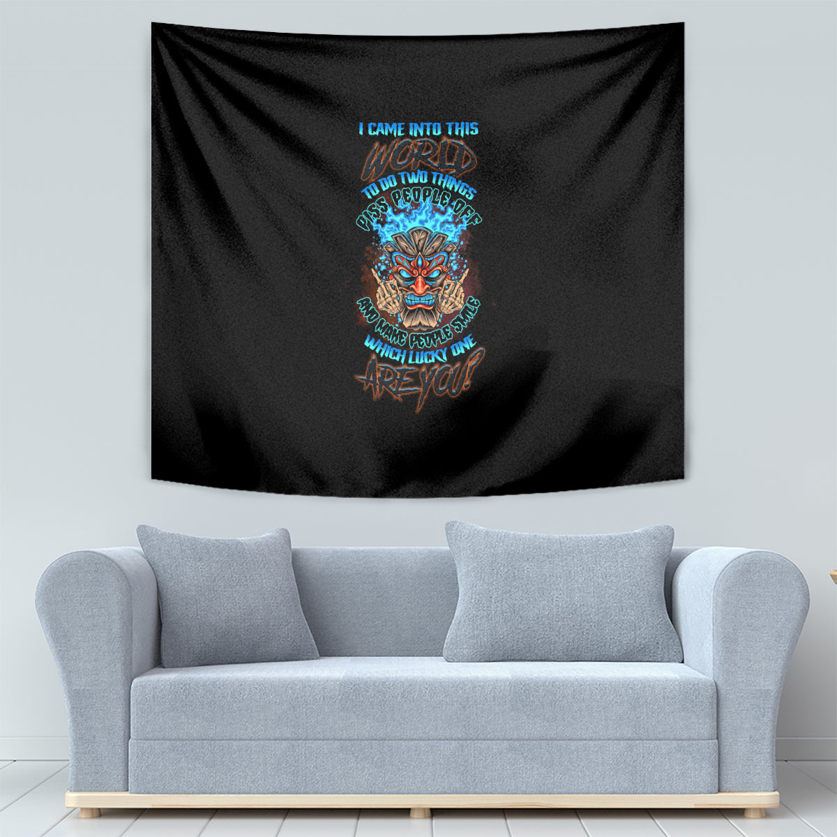 Black skull tiki tapestry with multicolor text graphic, on living room wall