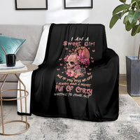 Black fleece blanket with flower skull artwork and I Am A Sweet Girl text