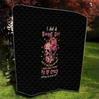 Black quilt blanket with rounded edges, diamond stitching, and pink flower skull design